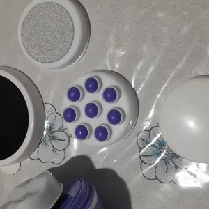Foto de cliente dos discos do massageador sobre a mesa